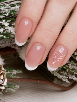 Snow White manicure on female hands. Winter nail design.
